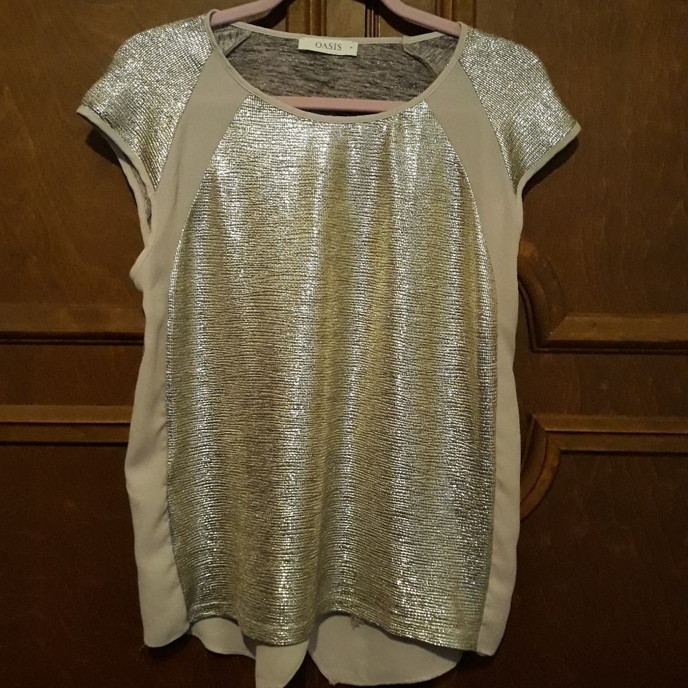 An Oasis glistening silver fun top!